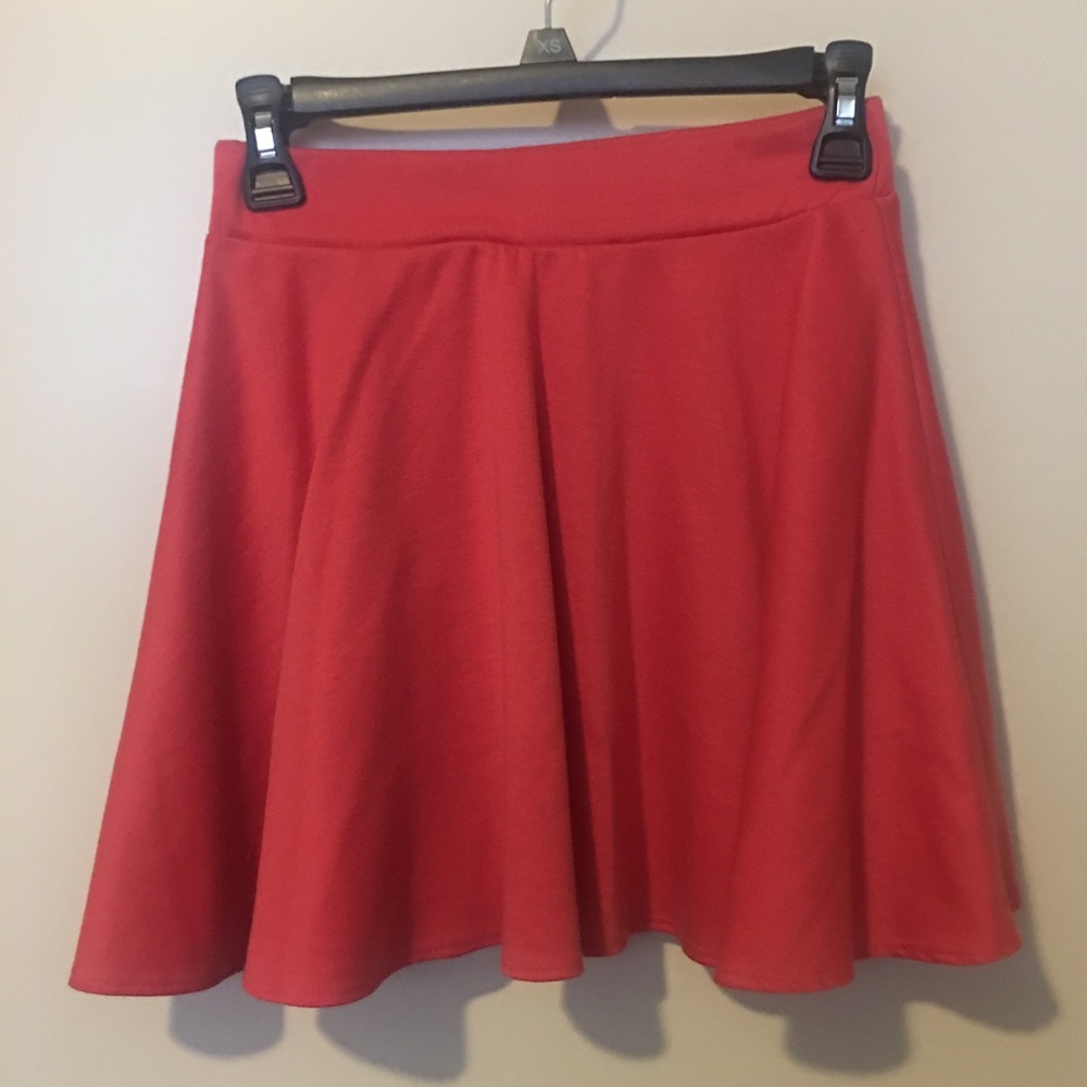 Orange pleated mini skirt, brand new condition